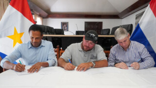 1. The signing of the contract with Work Monster B.V. to expand and renovate the Sacred Heart School. From left to right: Island Secretary Tim Muller, Brian Hassell of Work Monster and Island Governor Jonathan Johnson.